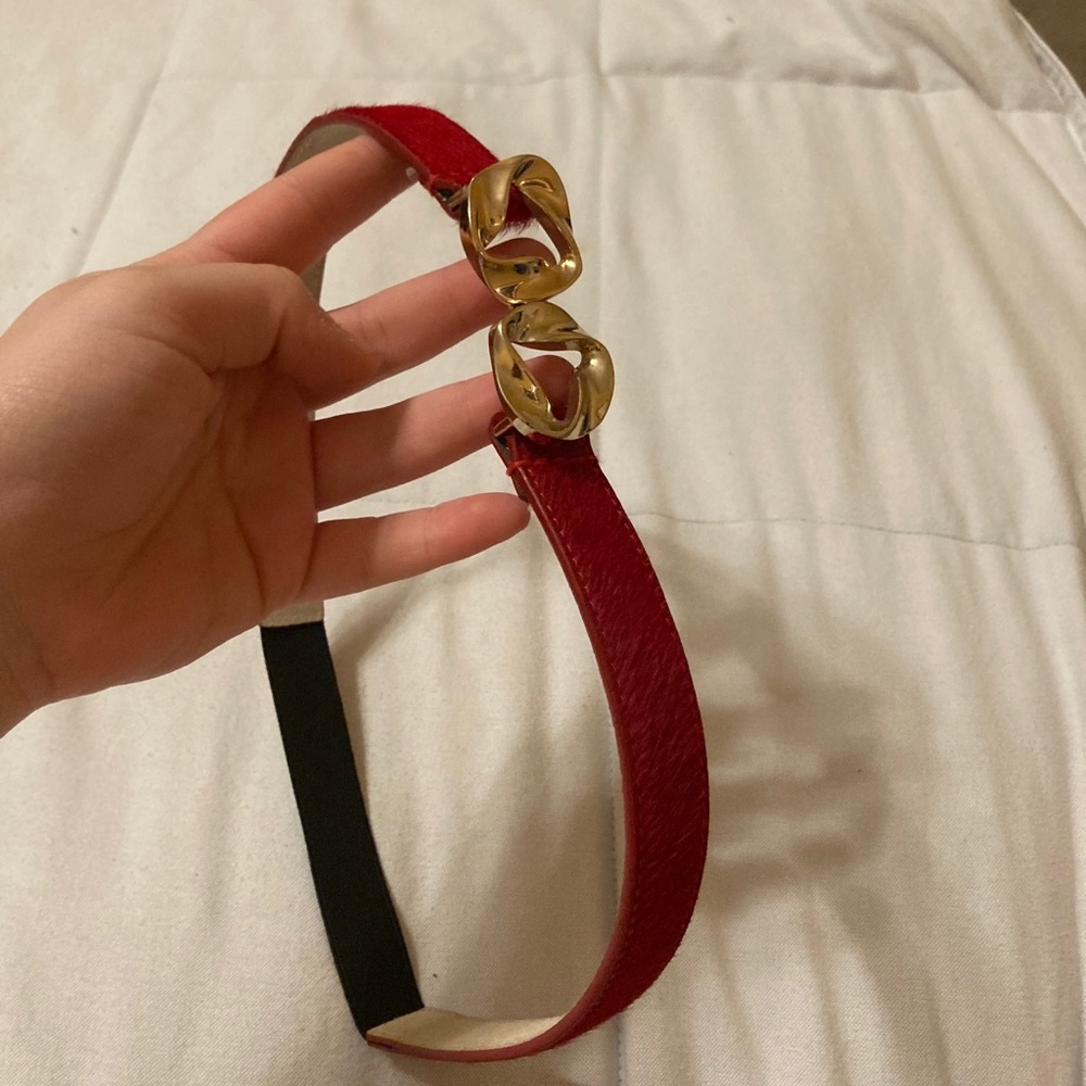 Red hair leather belt with elaborate gold clasp